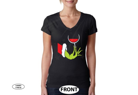 Grinch hand holding wine glass